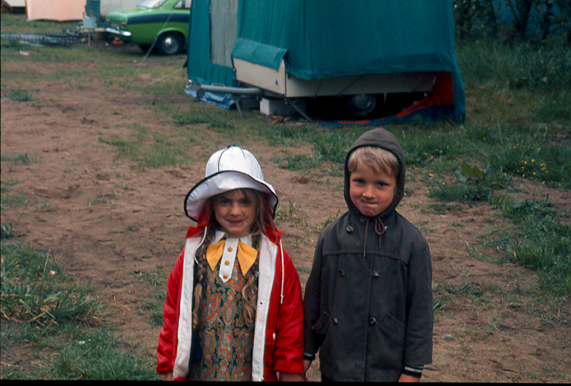 two young children looking at the camera